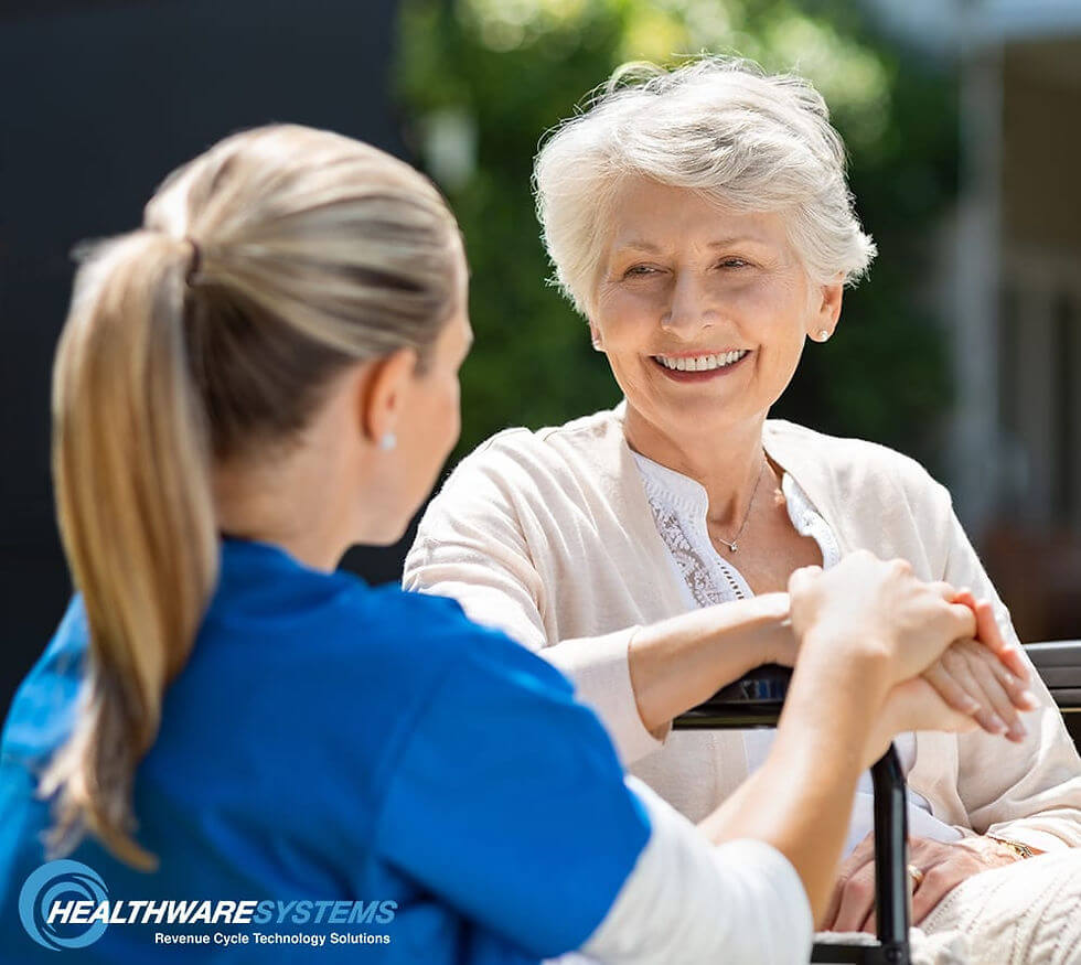 A nurse speaks with an elderly patient: Directing assistance toward at-risk patients can reduce hospital readmission rates.