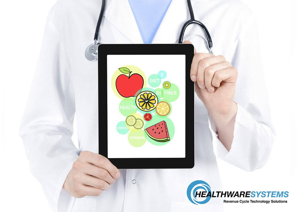 A doctor holds a tablet showing healthy food images representing the blog topic – reduce patient malnutrition.