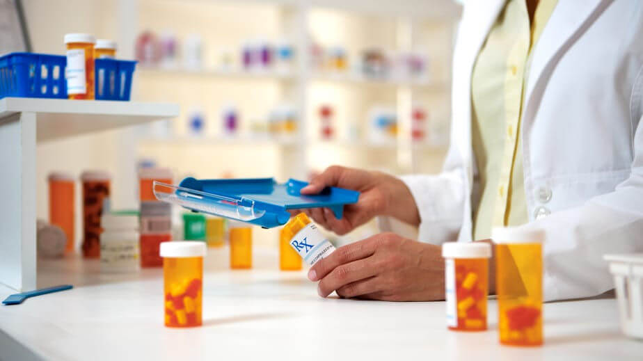 A pharmacist fills prescriptions: Improving interoperability in healthcare can help prevent adverse drug events that affect public health and patient safety.